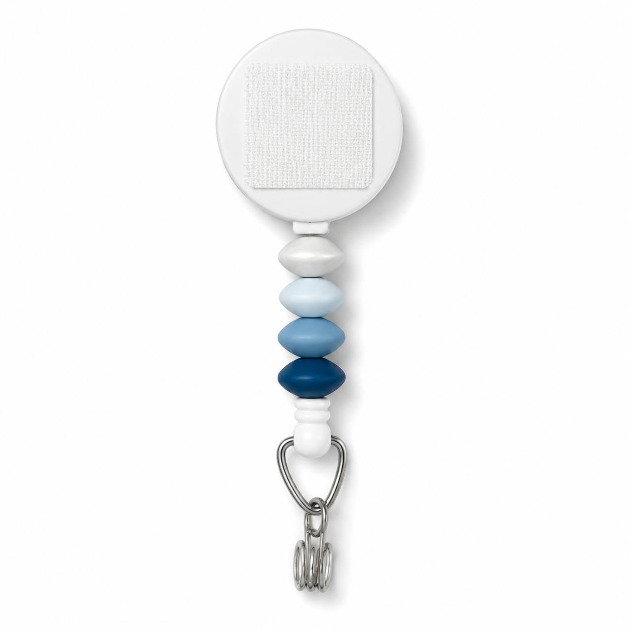 Blue ombre interchangeable beaded badge reel featuring layered blue silicone accent beads and a retractable badge holder.