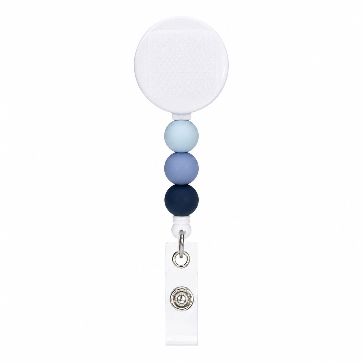 Blue Skies badge reel featuring light blue, periwinkle, and navy silicone beads with an interchangeable topper area on a retractable badge reel.