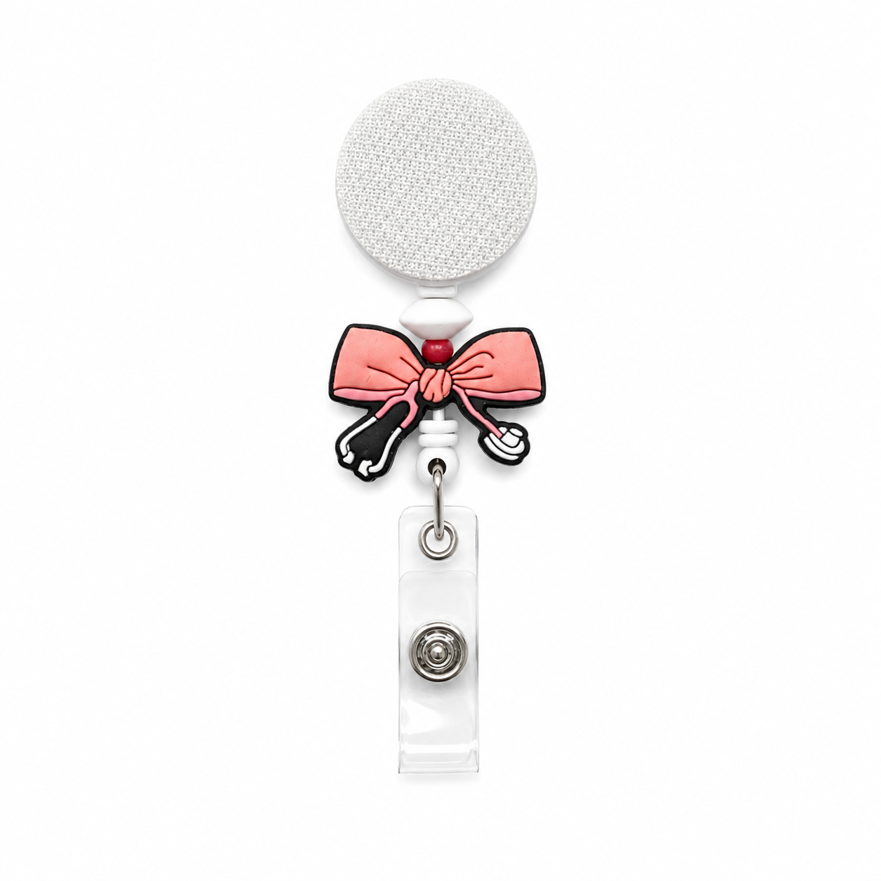 Coquette pink bow stethoscope badge reel with white and red bead accents, retractable holder and clear badge attachment for nurses and healthcare workers.