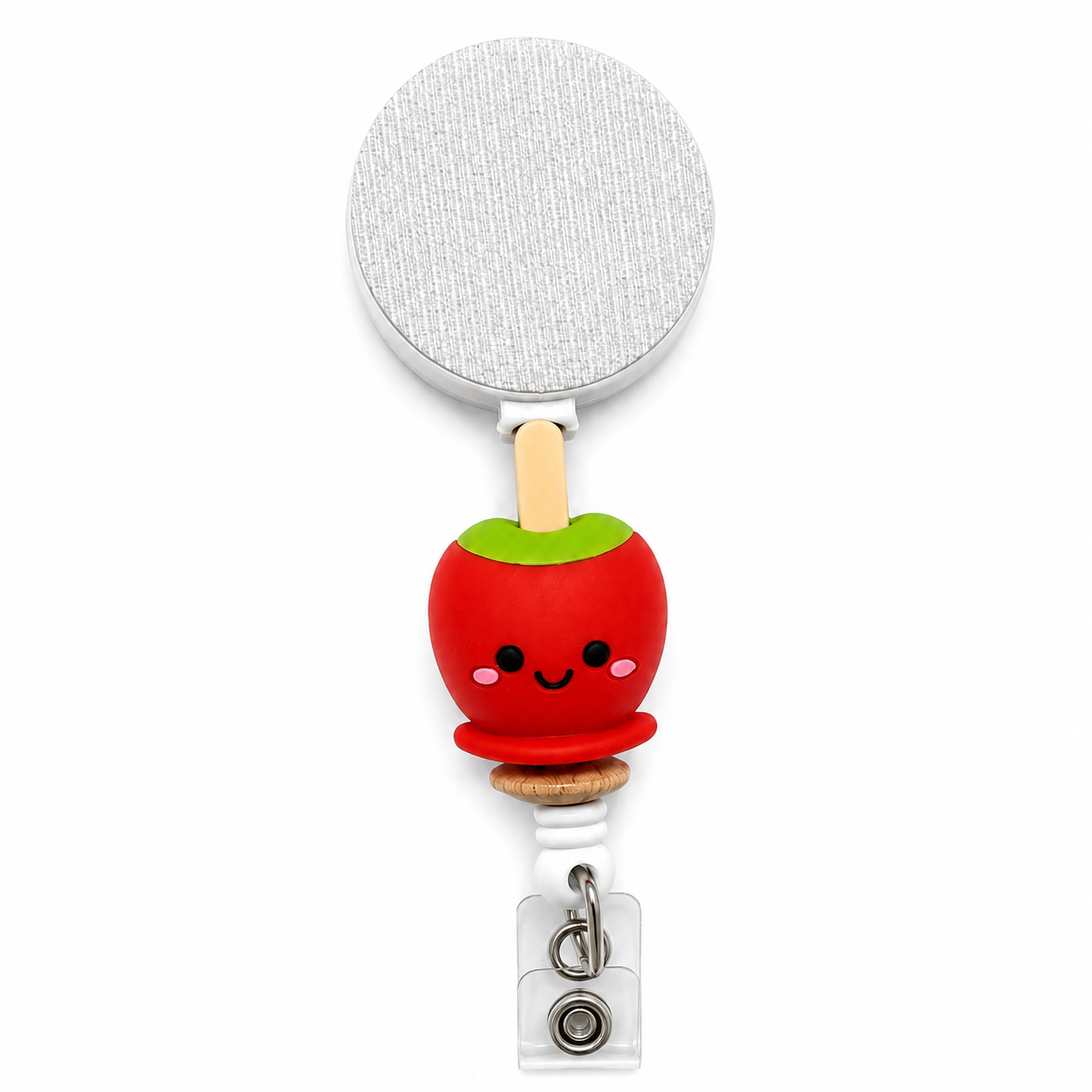 Candy Apple badge reel featuring a smiling red candy apple with a green top and popsicle stick handle, retractable badge reel functionality, and a secure badge holder attachment.