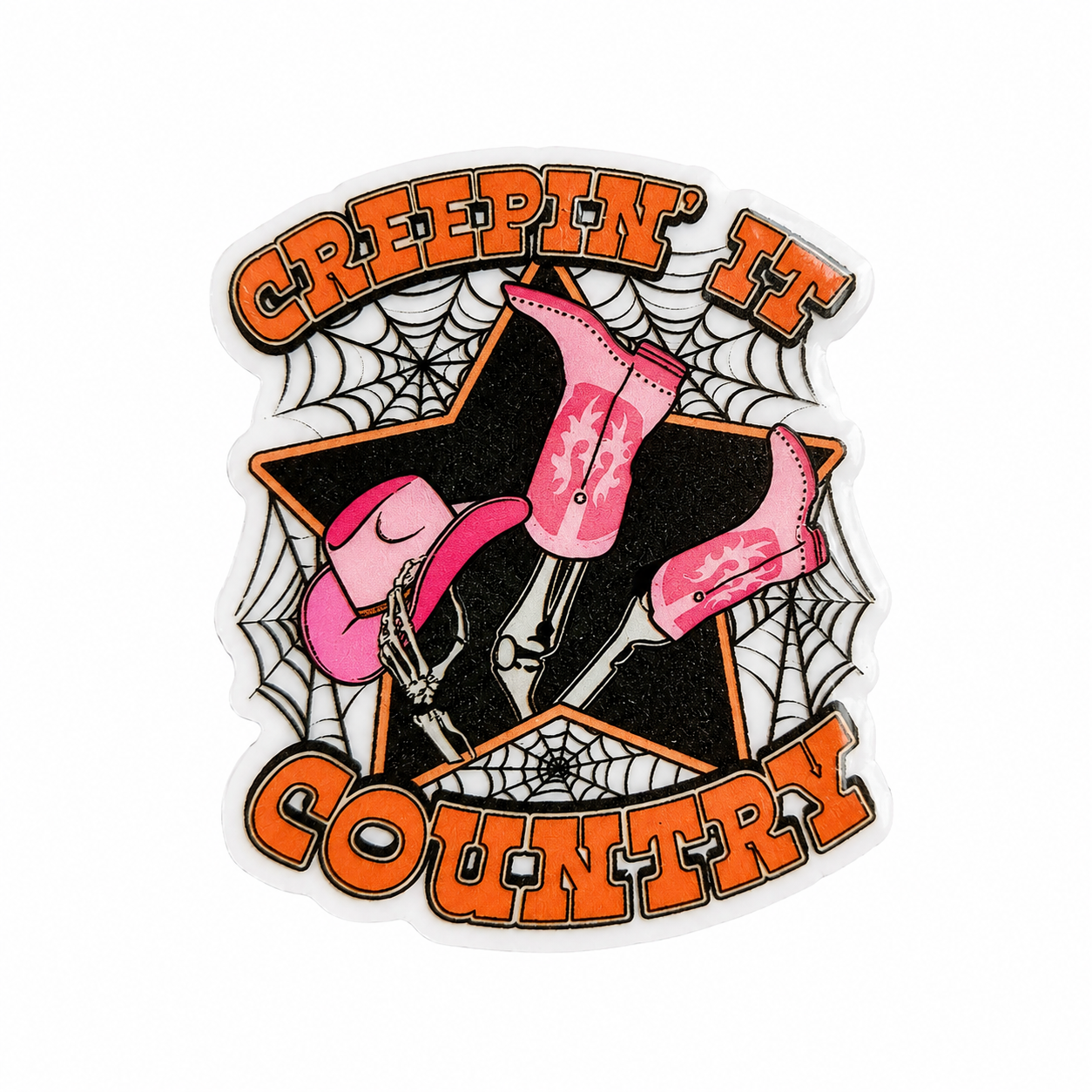 Creepin' It Country plastic add-on with pink cowgirl boots, cowboy hat, skeleton hand, and spiderweb design, compatible with interchangeable badge reel bases as a spooky western accessory.