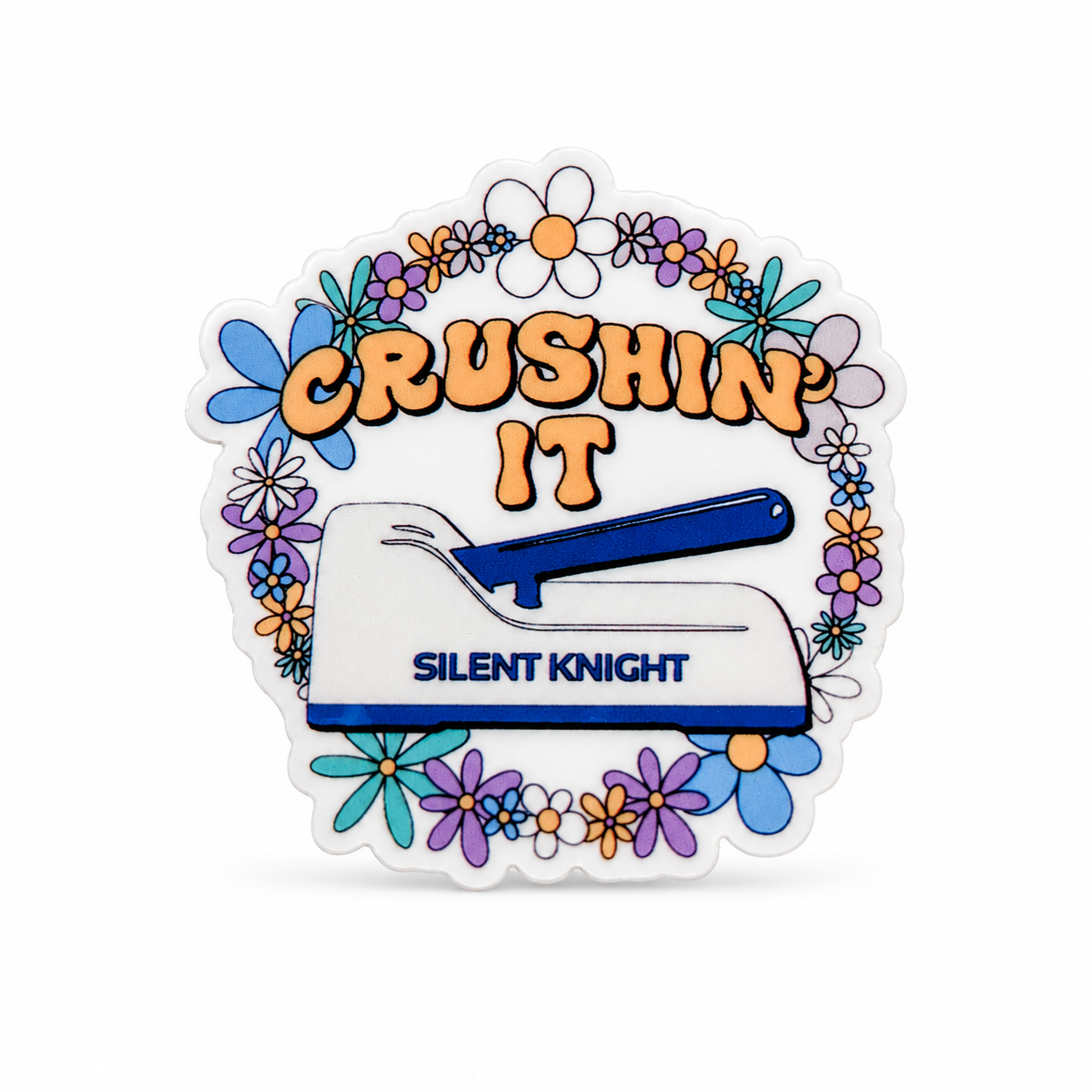 CRUSHIN’ IT SILENT KNIGHT plastic add-on with a blue stapler and colorful flowers, a funny office accessory compatible with interchangeable badge reel bases.