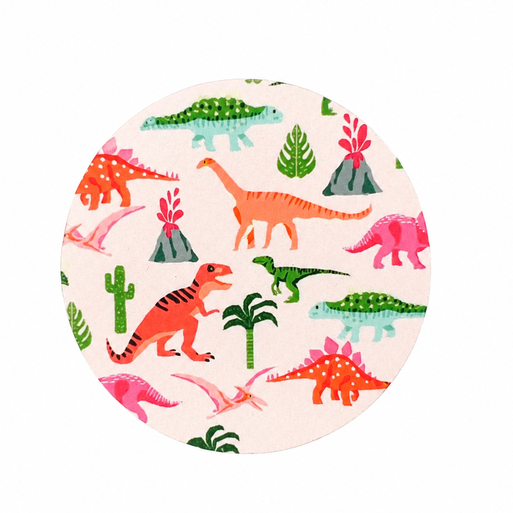 Cute dinosaur hard board add-on featuring colorful dinosaurs, volcanoes, palm trees, tropical leaves, and cacti, compatible with interchangeable badge reel bases. Perfect for pediatric nurses, childcare professionals, and teachers.
