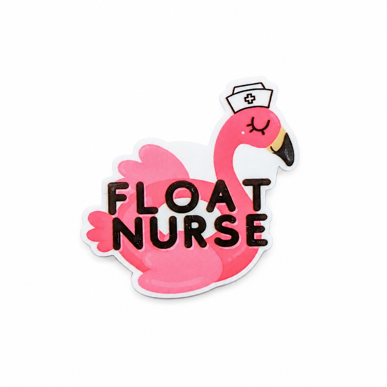 FLOAT NURSE plastic add-on with pink flamingo nurse design, compatible with interchangeable badge reel bases.