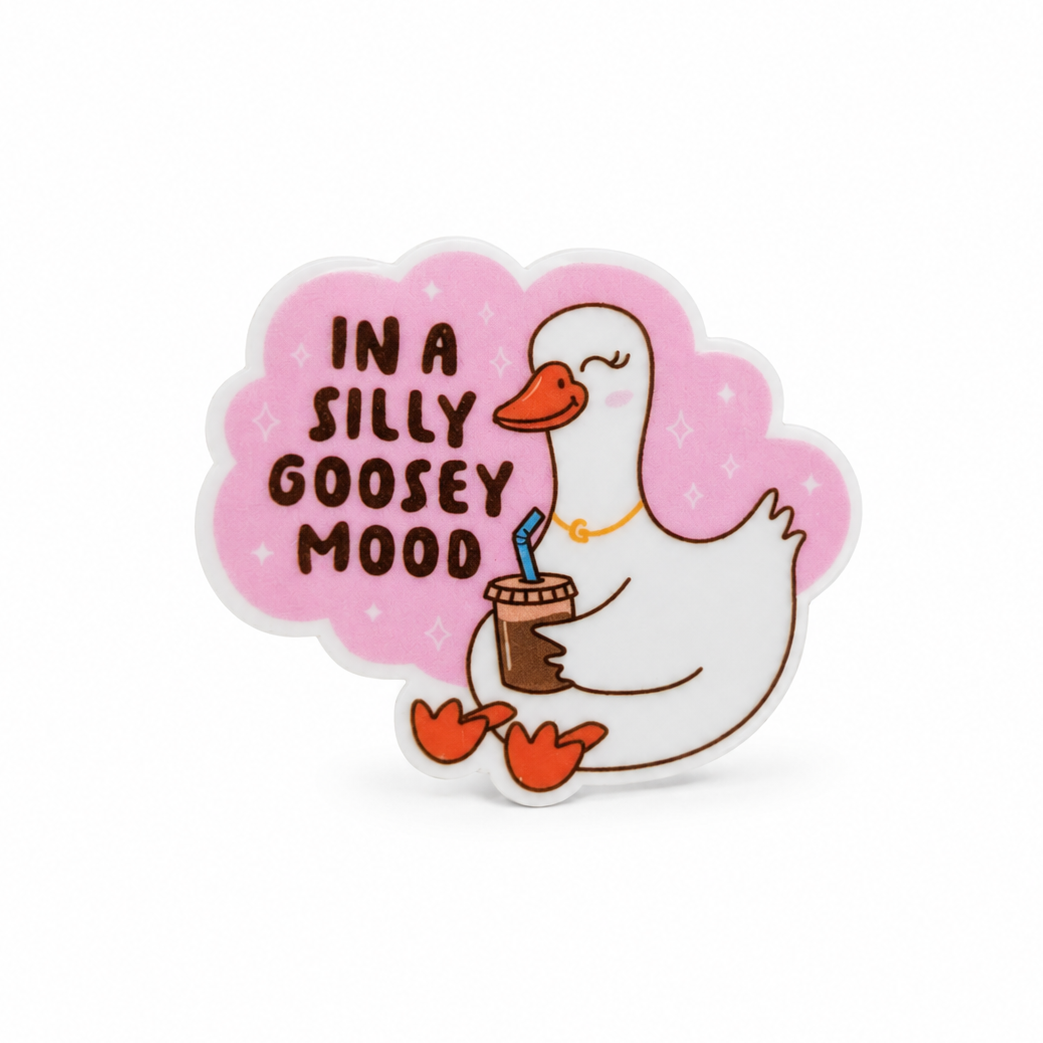 In A Silly Goosey Mood plastic add-on featuring a cute white goose holding an iced coffee, compatible with interchangeable badge reel bases.