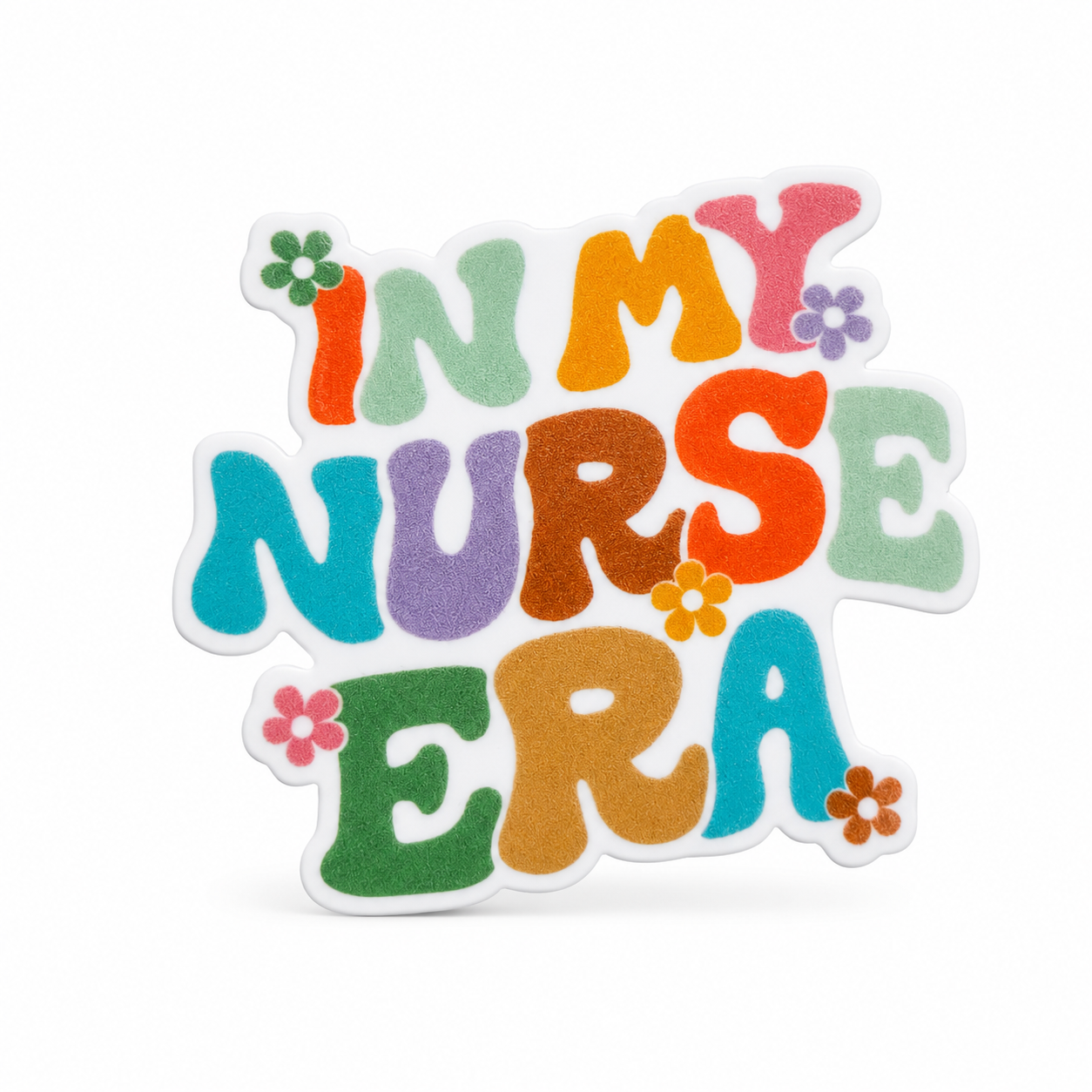 IN MY NURSE ERA plastic add-on with colorful retro lettering and small flower accents, compatible with interchangeable badge reel bases for nurses