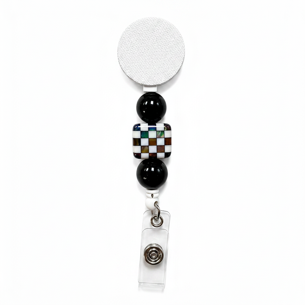 Iridescent checkerboard badge reel featuring a multicolor mosaic checkerboard bead with glossy black decorative beads on a white retractable badge reel. Stylish interchangeable beaded work badge accessory.