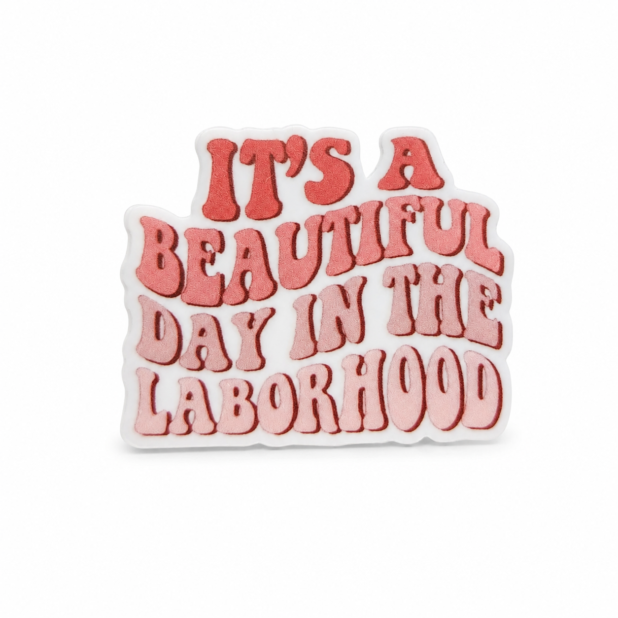 It's A Beautiful Day In The Laborhood plastic add-on with retro pink lettering, compatible with interchangeable badge reel bases for labor and delivery nurses.