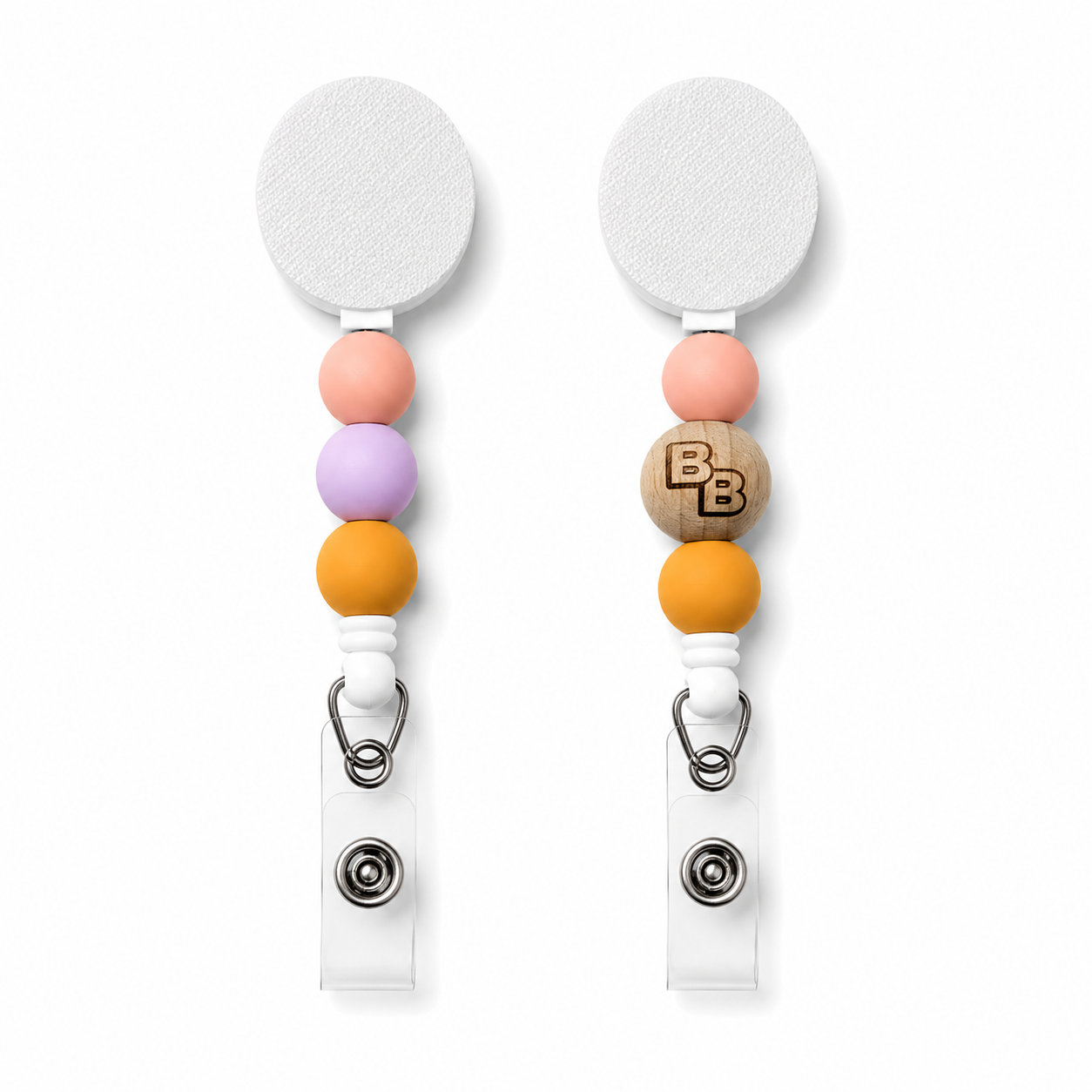 Keeping It Reel Badge Beauties interchangeable badge reel featuring engraved wooden logo bead with peach, lavender and mustard silicone beads on a retractable badge holder.
