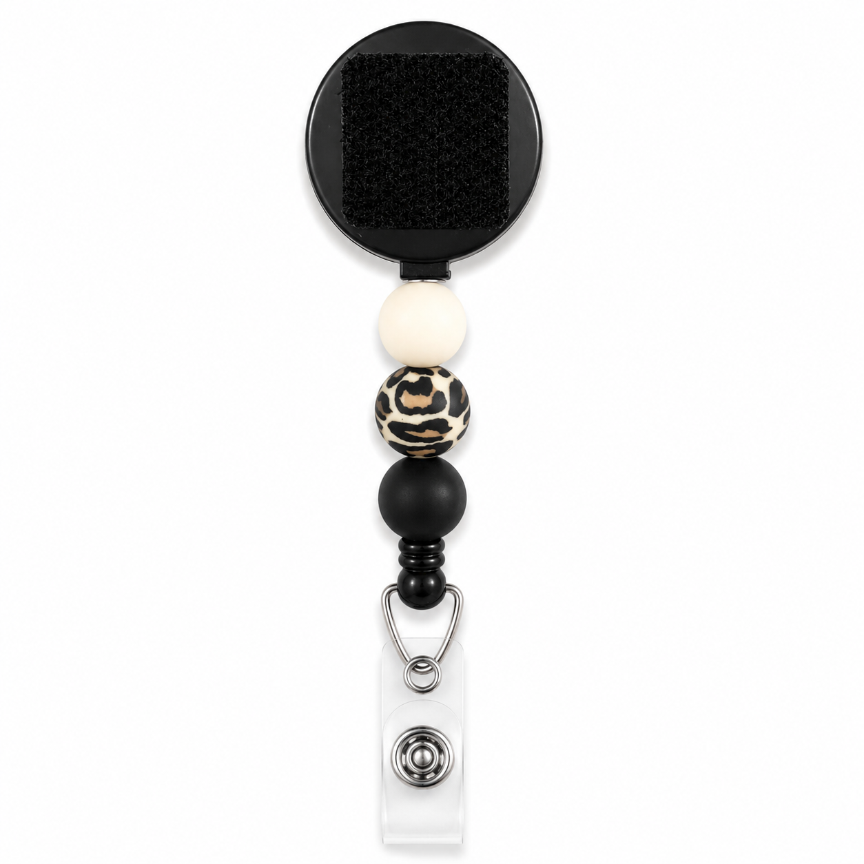 Neutral interchangeable beaded badge reel with black, white, and leopard print silicone beads and a retractable badge holder.