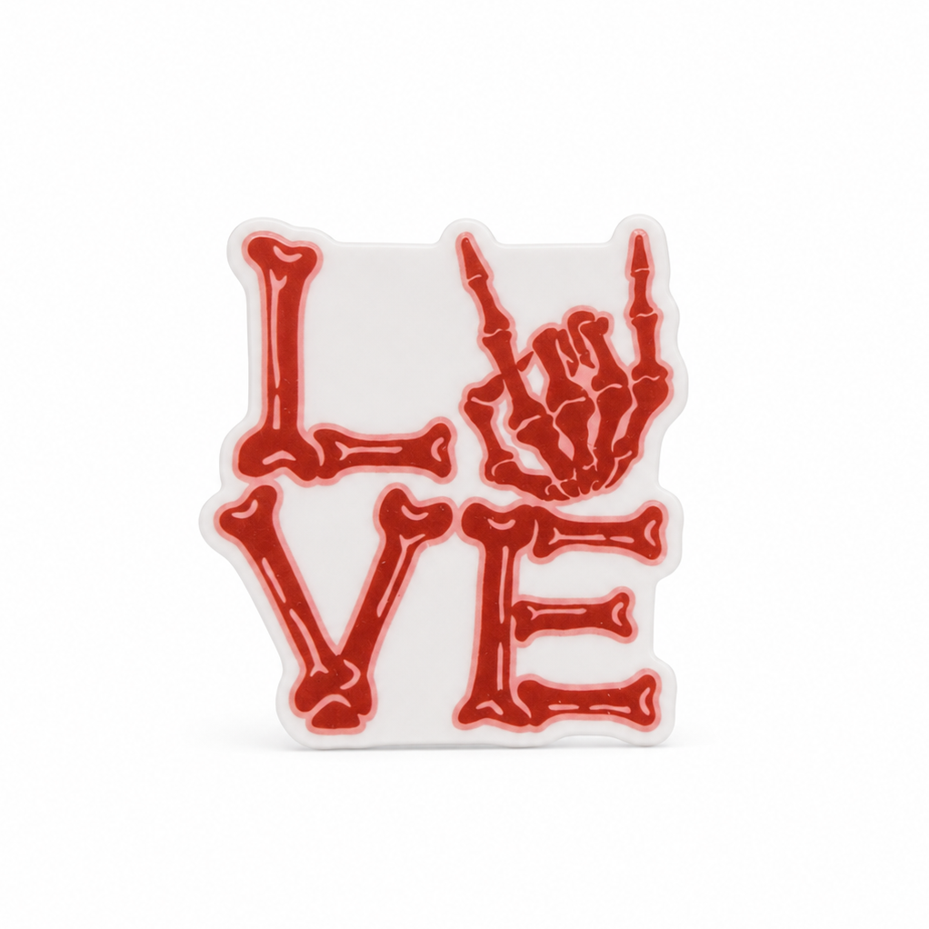 LOVE plastic add-on with red bone-style lettering and skeleton hand design, compatible with interchangeable badge reel bases for a gothic skeleton accessory.