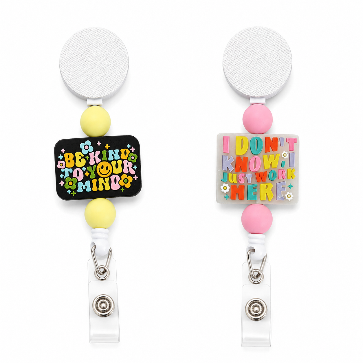 Interchangeable badge reel featuring "Be Kind to Your Mind" and "I Don't Know, I Just Work Here" designs with colorful beads and retractable badge holder.