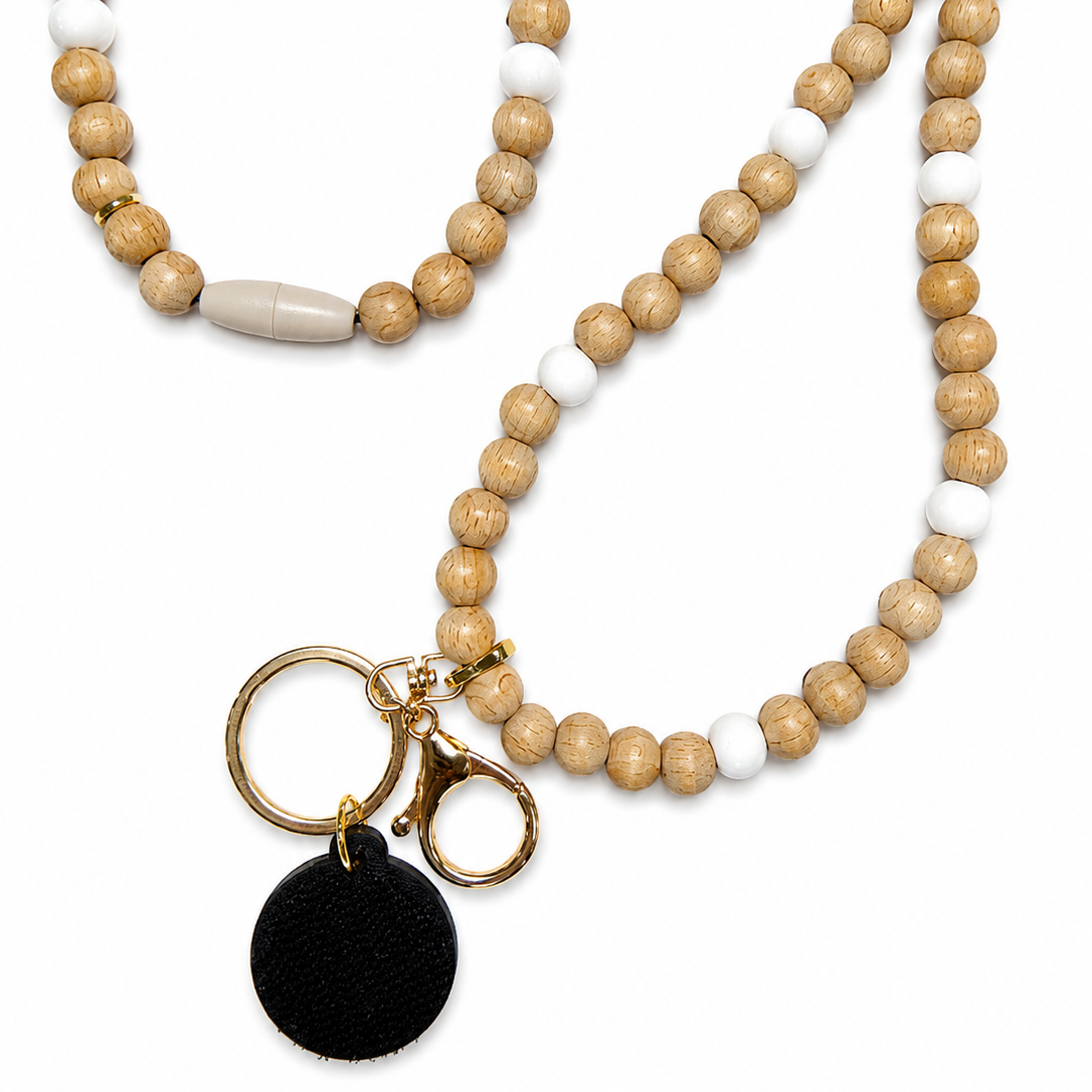 Natural wood and white silicone interchangeable beaded lanyard with gold-tone hardware and attached hook-and-loop disc, compatible with Badge Beauties interchangeable hardboards and plastic add-ons.