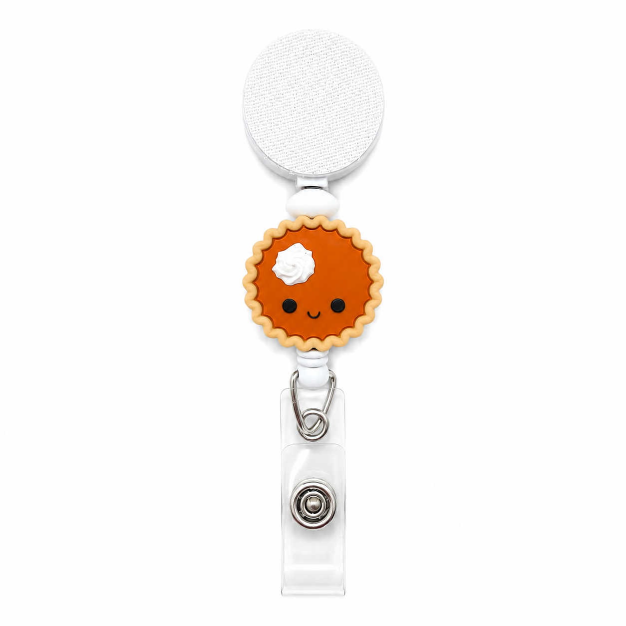 Sweet pumpkin pie interchangeable beaded badge reel featuring a smiling pumpkin pie with whipped cream on a white retractable badge reel.