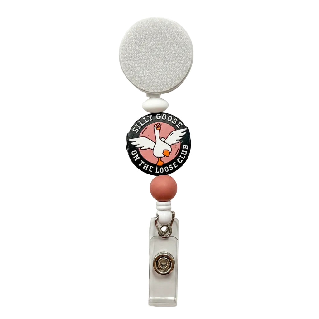 Silly Goose On The Loose Club badge reel featuring a white goose design with white and blush silicone beads on a retractable interchangeable badge reel.