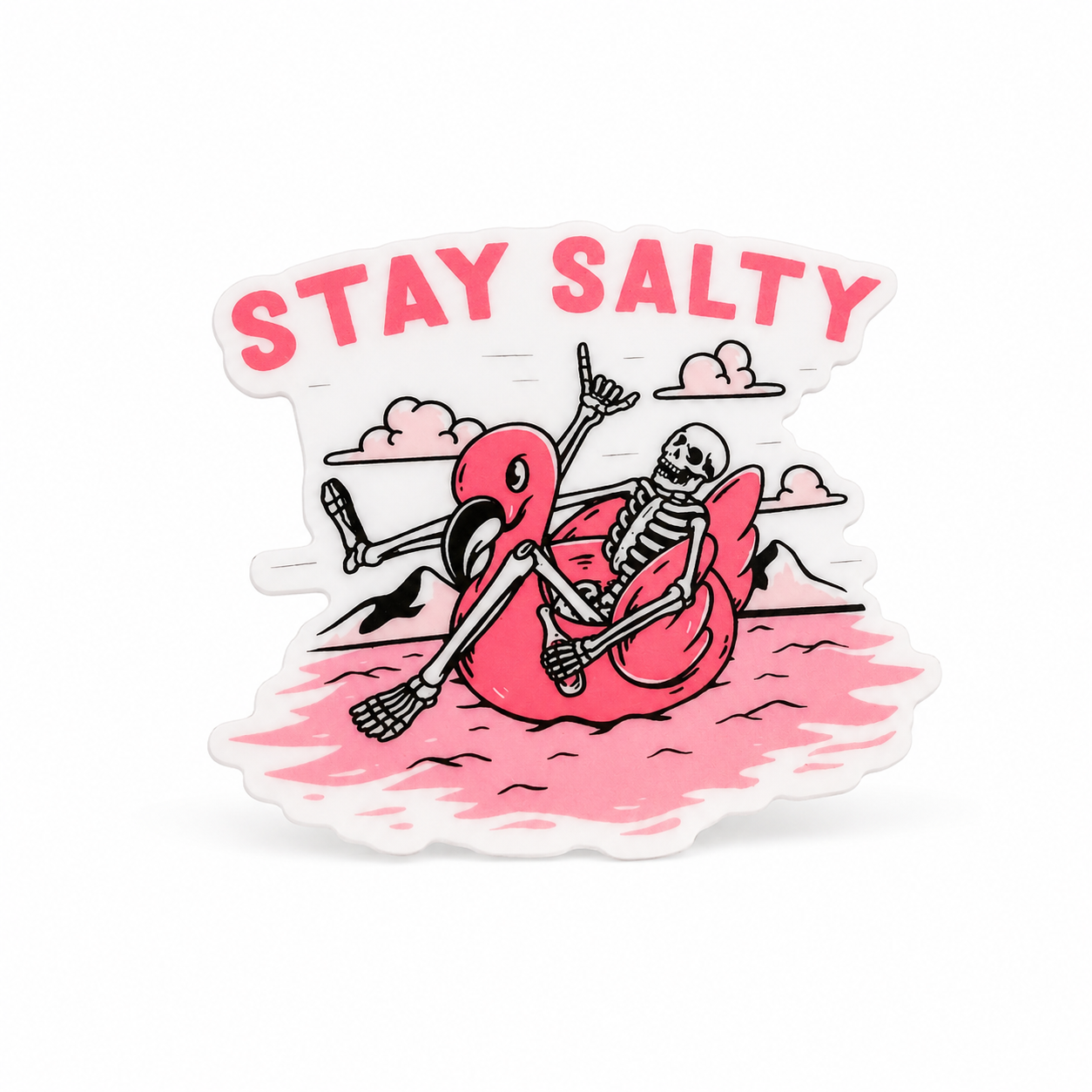 STAY SALTY plastic add-on with a skeleton lounging on a pink flamingo float, compatible with interchangeable badge reel bases for spooky beach lovers.