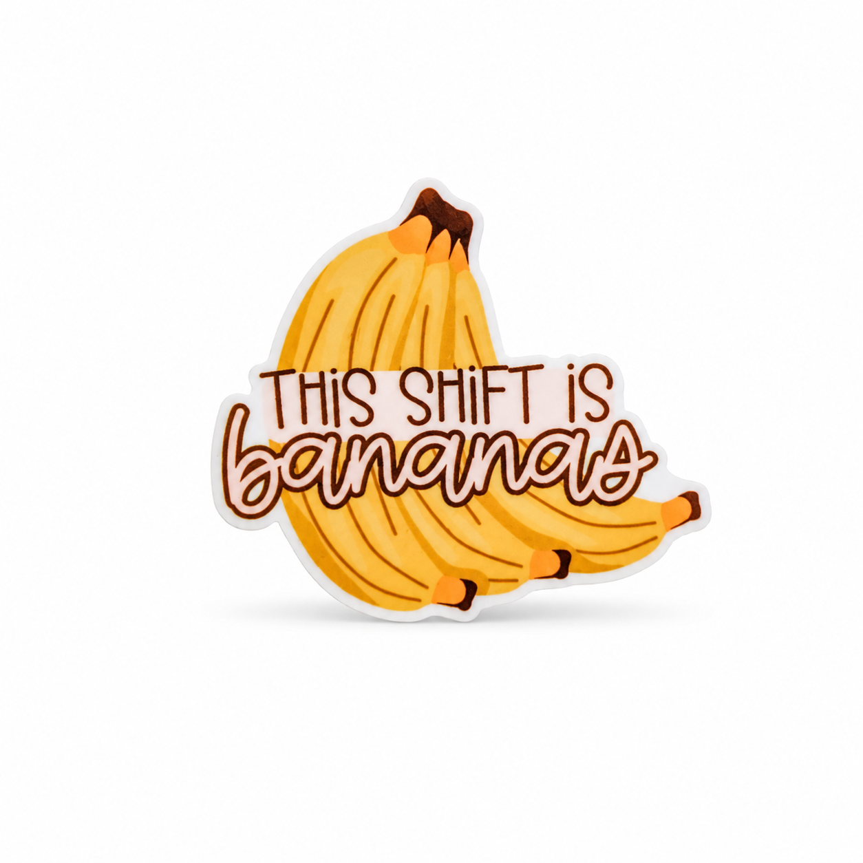 THIS SHIFT IS bananas plastic add-on with an illustrated bunch of yellow bananas, a funny work accessory compatible with interchangeable badge reel bases.