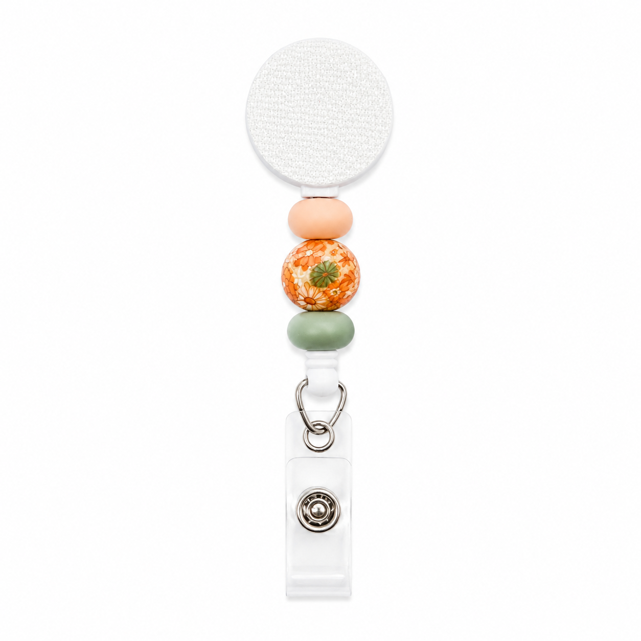 Vintage floral beaded badge reel featuring a botanical flower accent bead with peach and sage green silicone beads on a white retractable badge reel.
