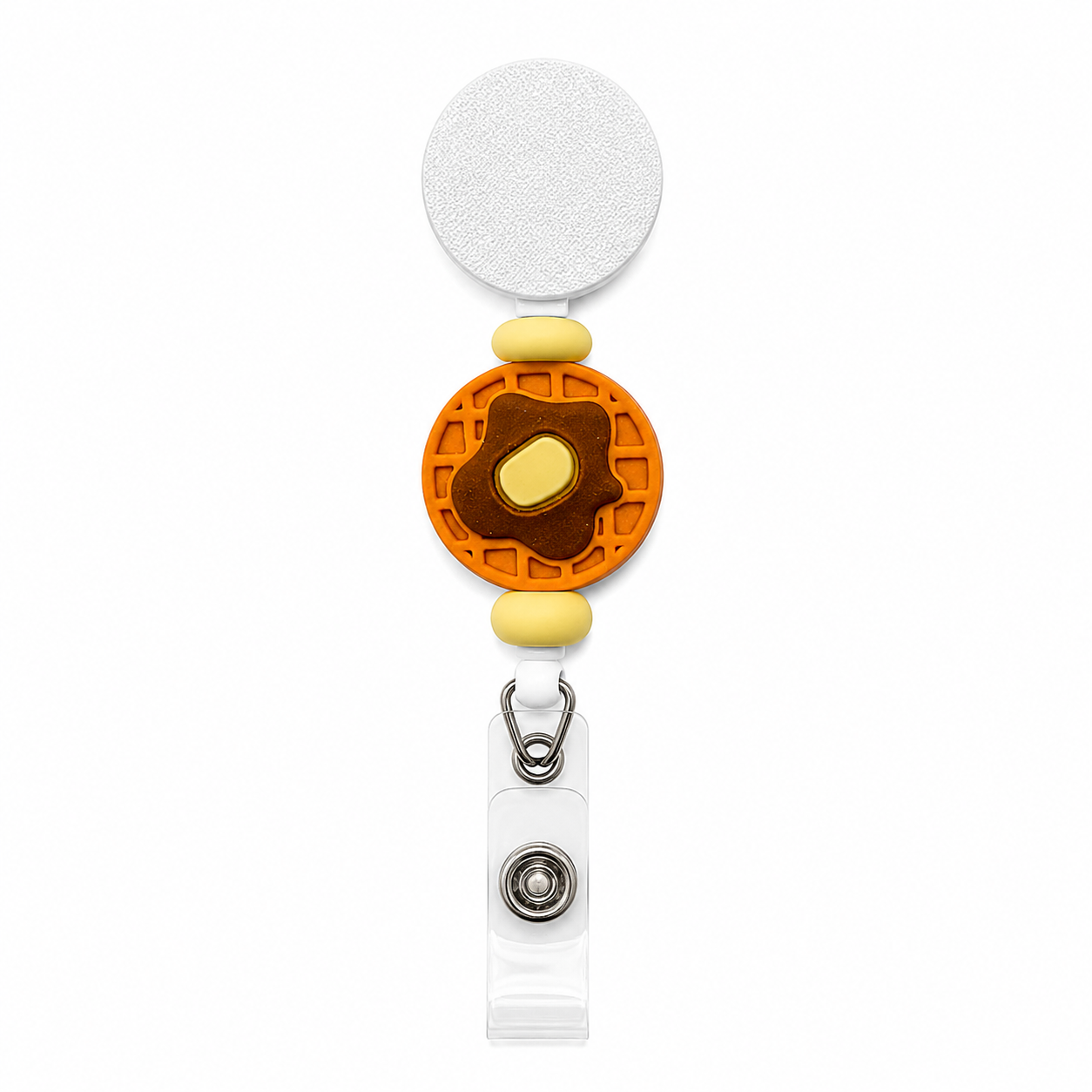 Buttered waffle badge reel featuring a waffle with butter design, soft yellow silicone beads, and a white retractable interchangeable badge reel.