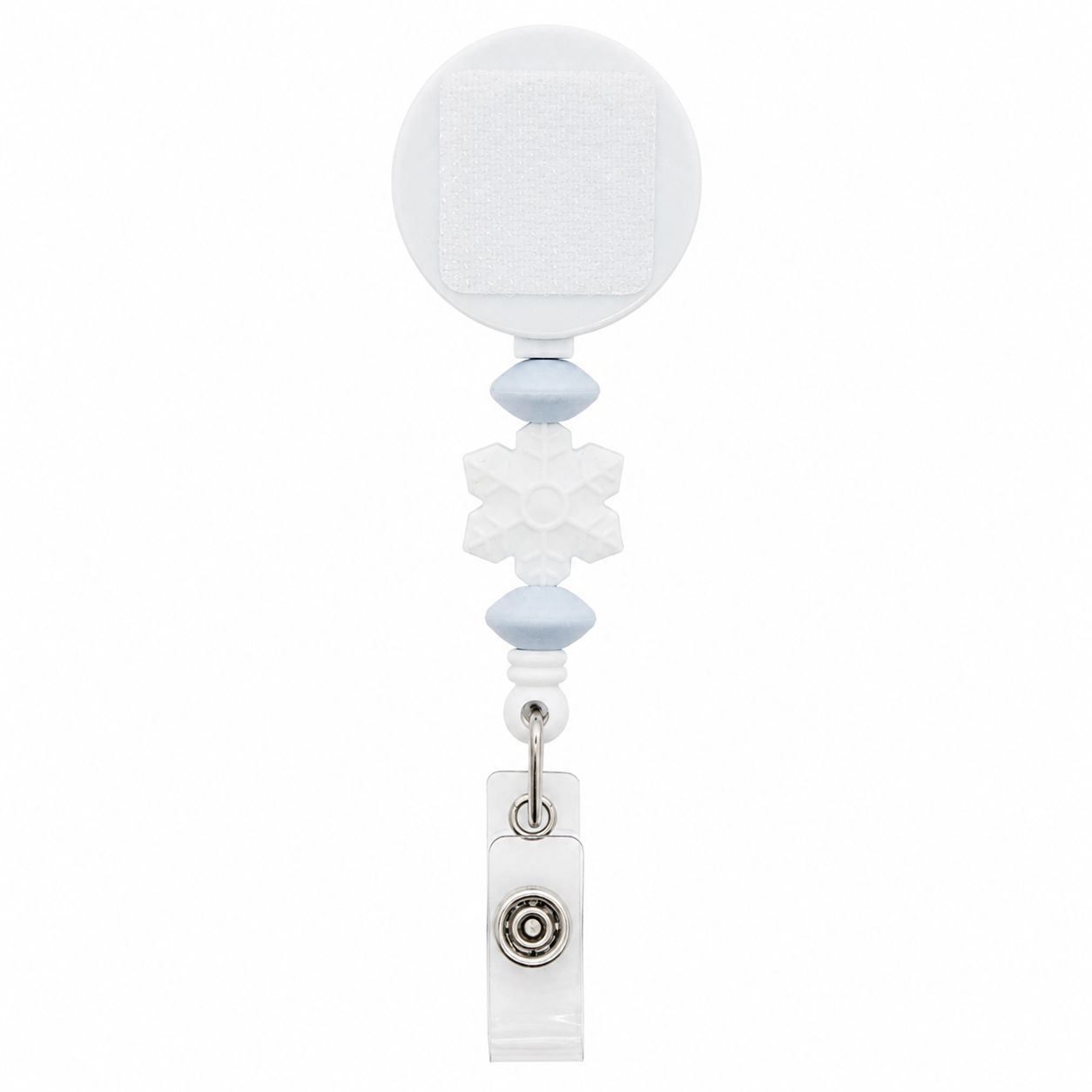 White snowflake badge reel featuring pale blue bead accents, a white retractable reel, and a clear badge holder attachment for winter workwear.