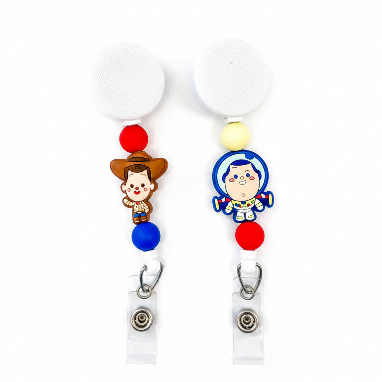 Woody and Buzz interchangeable badge reel with red, yellow, and blue silicone beads on a white retractable beaded badge reel.