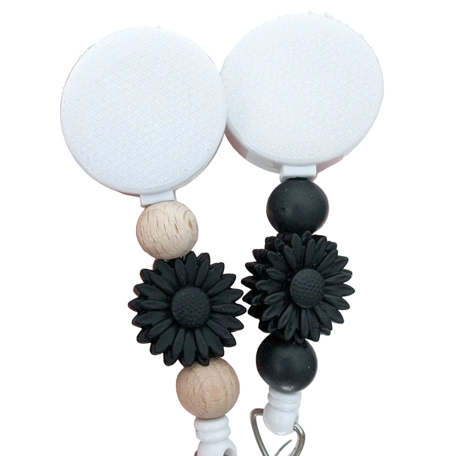 Black daisy badge reel with decorative silicone and natural wood beads, interchangeable topper area, available in two beaded styles on a retractable badge reel.