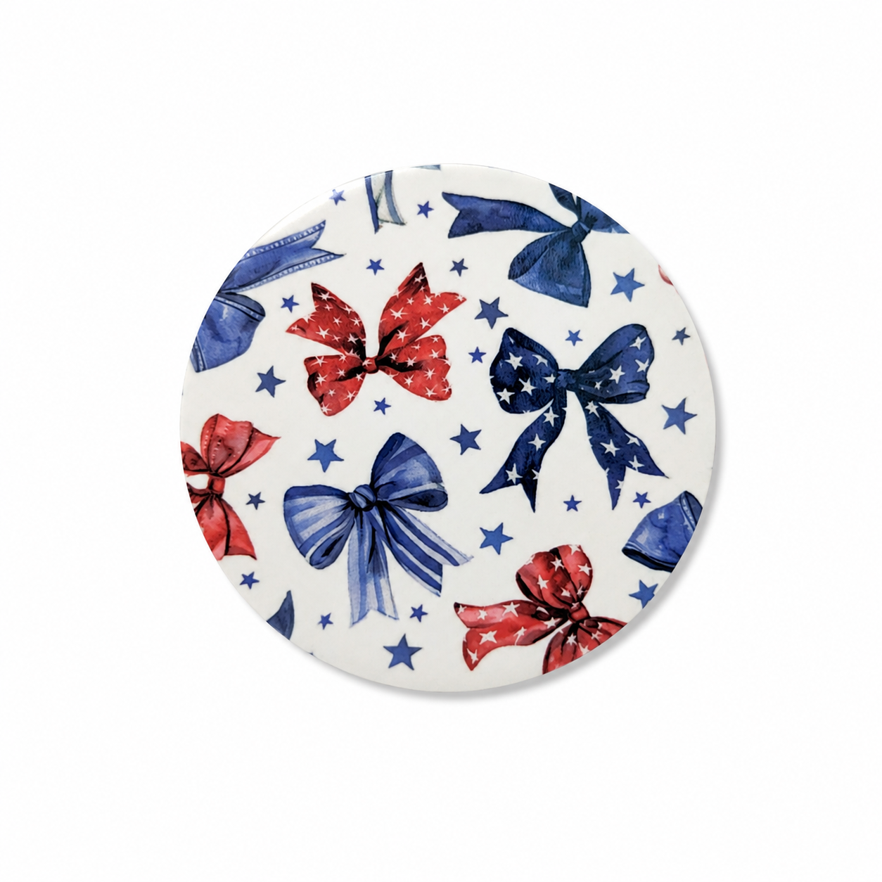 Patriotic bow hard board add-on featuring red and blue bows with stars, stripes, and scattered blue stars, compatible with interchangeable badge reel bases.