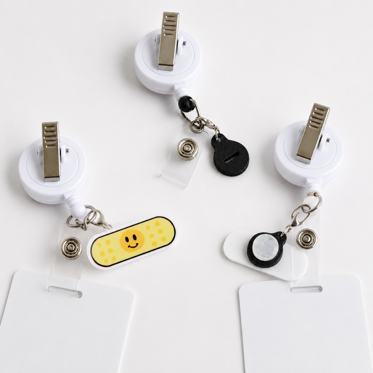 Badge reel charm adapter with clip attachment for interchangeable charms
