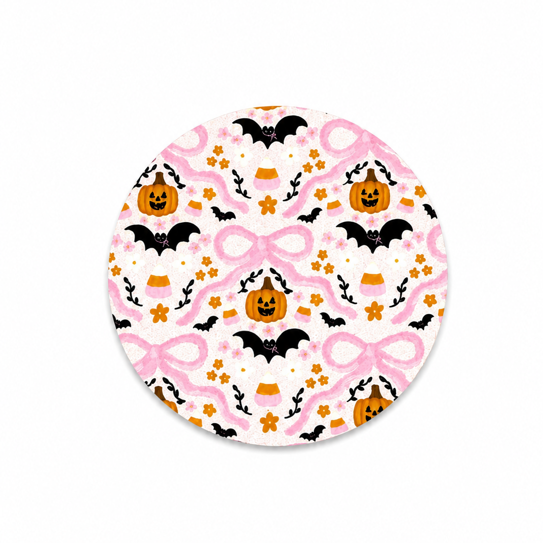 Pink Halloween hard board add-on featuring coquette bows, pumpkins, bats and floral accents, compatible with interchangeable badge reel bases.
