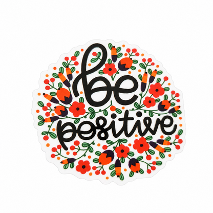 be positive plastic add-on with black lettering, red flowers, and green leaves, compatible with interchangeable badge reel bases for a positive floral accessory.