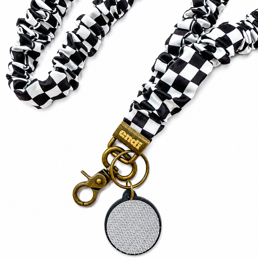 Black Checkerboard Interchangeable Andi Lanyard featuring a black and white checkerboard pattern, interchangeable badge lanyard compatible with interchangeable hardboards and plastic add-ons.