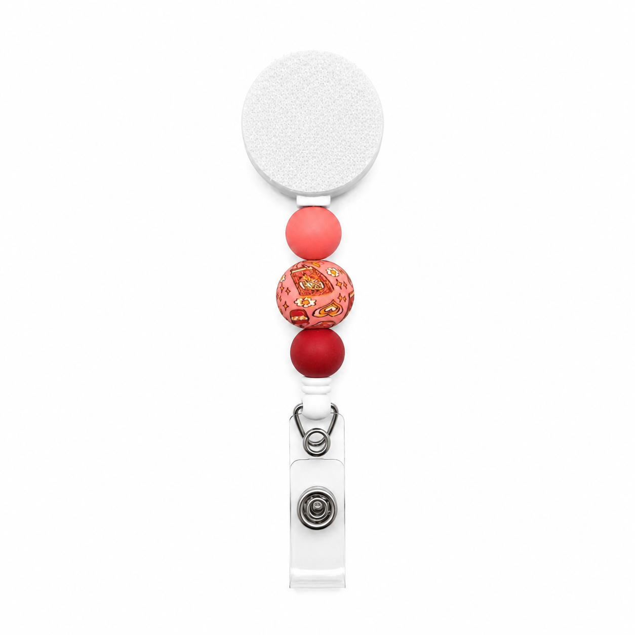 Book lover badge reel featuring pink and burgundy silicone beads with a book-themed printed focal bead on a white interchangeable retractable badge reel.