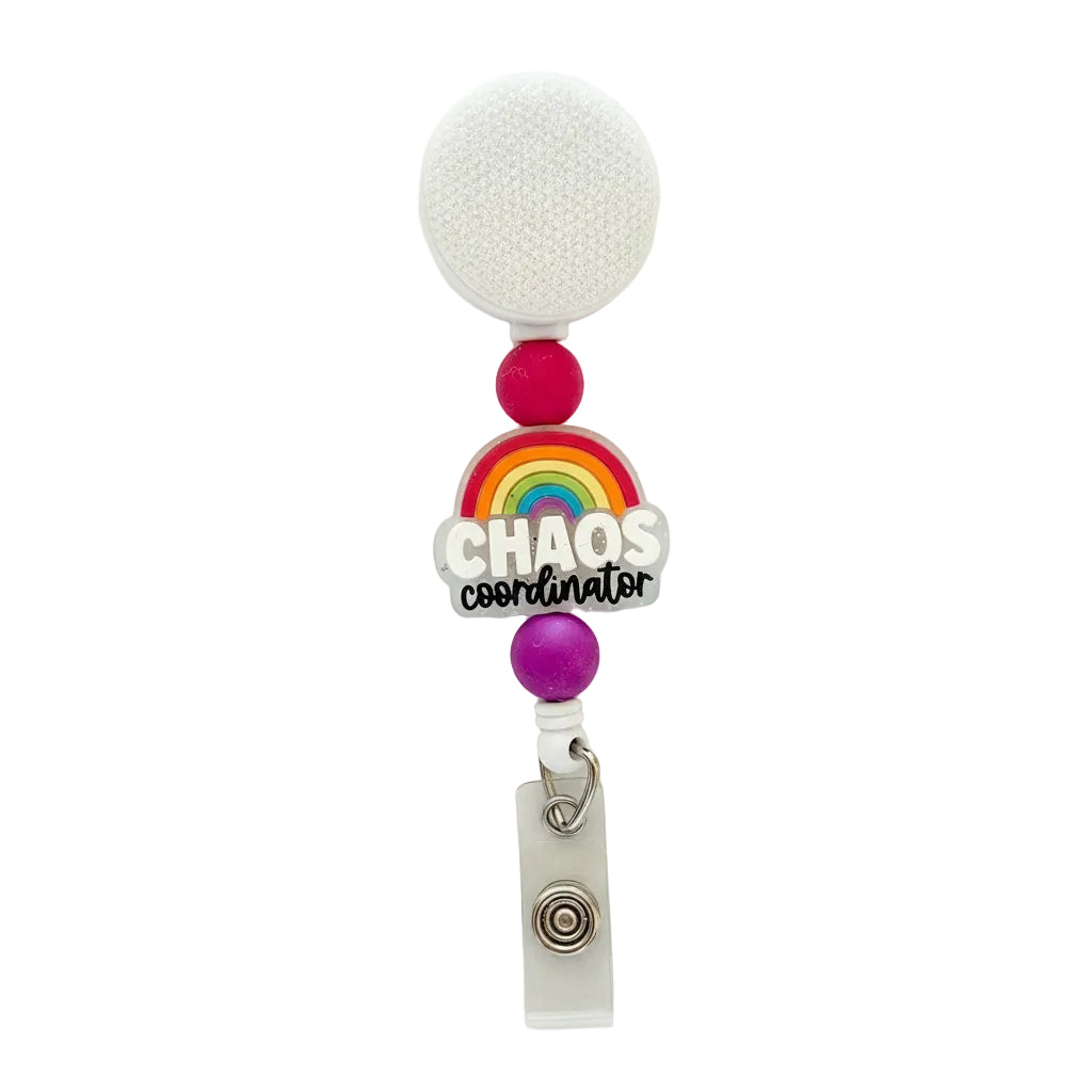 Chaos Coordinator badge reel featuring a colorful rainbow topper with bright pink and purple silicone beads on a white retractable interchangeable badge reel.