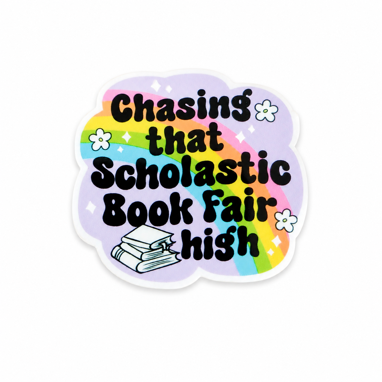 Plastic add-on featuring the text "Chasing that Scholastic Book Fair High" with a rainbow, flowers, and stacked books, compatible with interchangeable badge reel bases and perfect for book lovers.