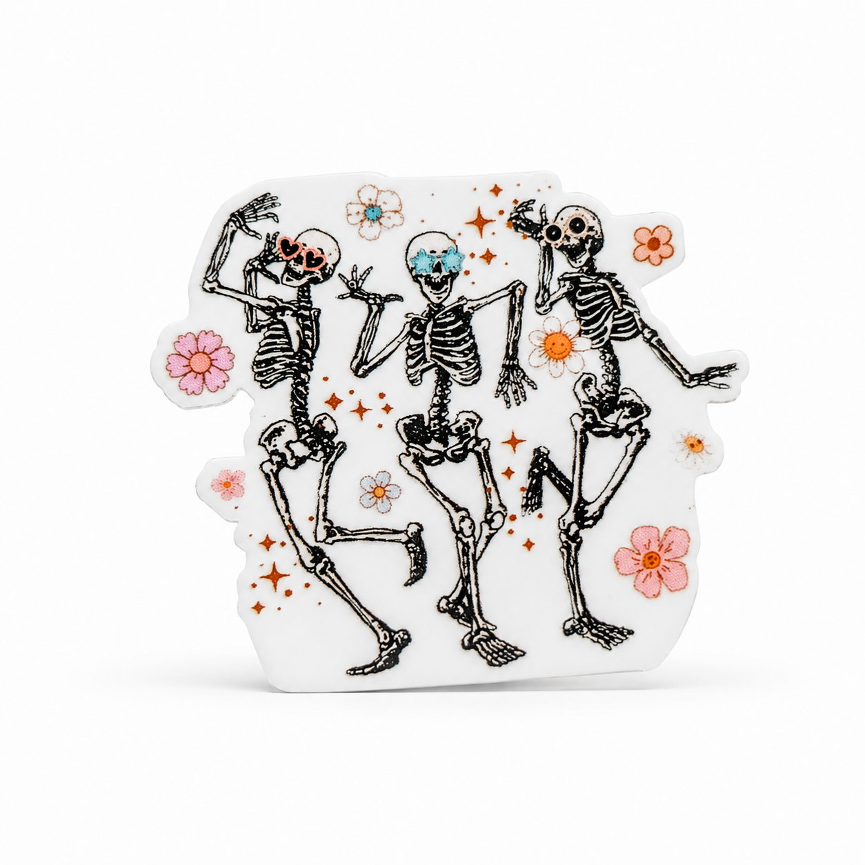 Dancing skeleton accessory plastic add-on with three skeletons, pastel flowers, and sparkles, compatible with interchangeable badge reel bases