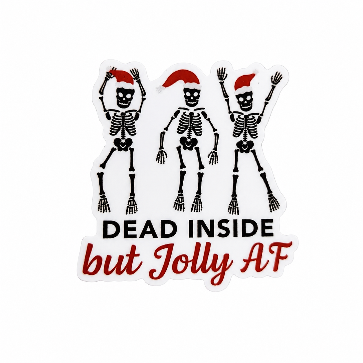 DEAD INSIDE but Jolly AF plastic add-on featuring three dancing skeletons wearing Santa hats, compatible with interchangeable badge reel bases.