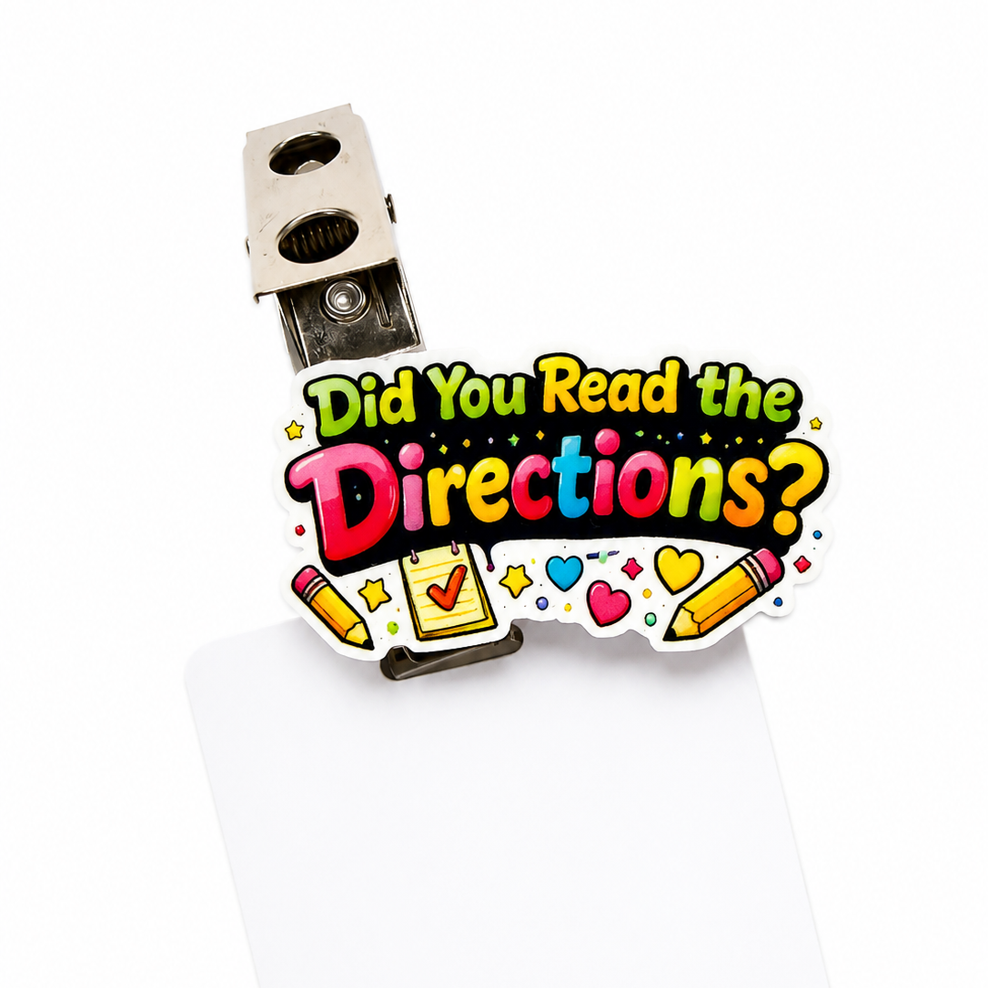 Colorful "Did You Read the Directions?" interchangeable ID badge charm with pencils, checklist, hearts, and stars for compatible Badge Beauties adapters.