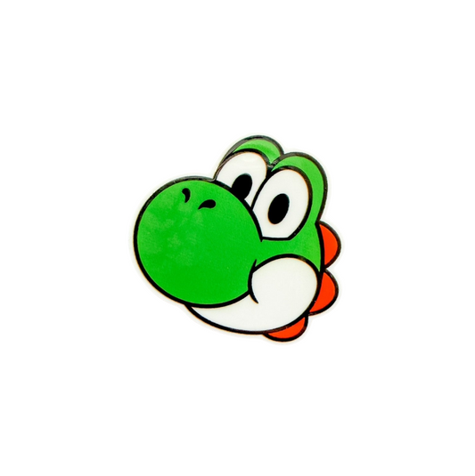 Dinosaur inspired plastic add-on featuring a cute green retro gaming character compatible with interchangeable badge reel bases, gamer accessory