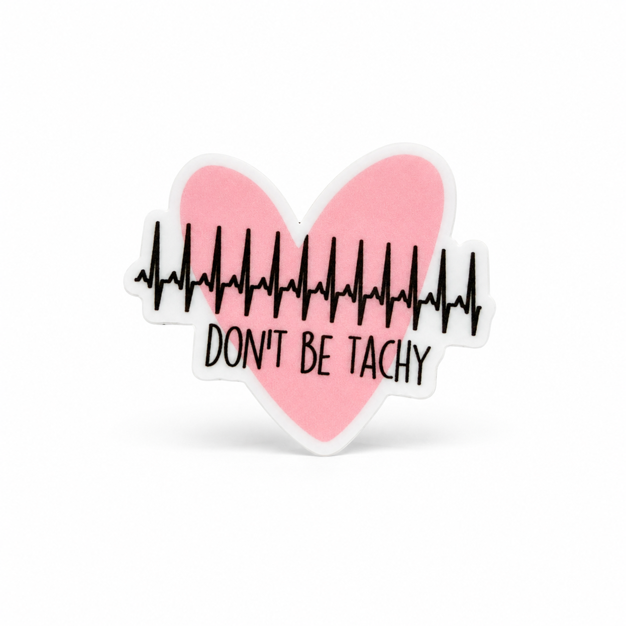DON’T BE TACHY plastic add-on with a pink heart and black EKG line, a funny cardiac nurse accessory compatible with interchangeable badge reel bases.