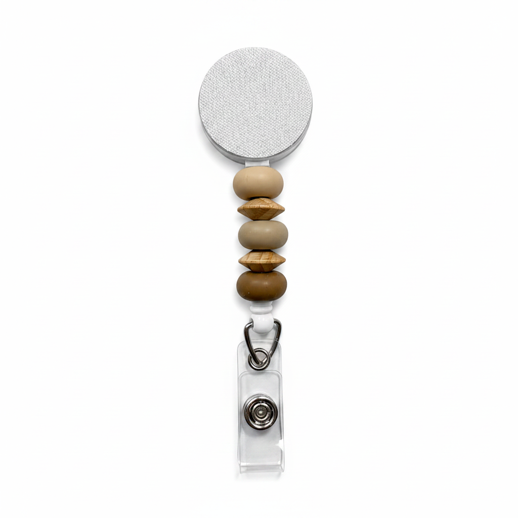 Driftwood badge reel featuring beige, taupe, and caramel decorative beads with natural wood accent beads on a white retractable badge reel. 