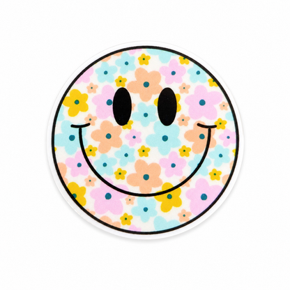Floral smiley face plastic add-on featuring pastel flowers and a cheerful smile design, compatible with interchangeable badge reel bases and perfect as a nurse badge accessory, healthcare badge accessory, and cute work accessory