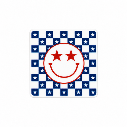 Fourth Of July Smiley Face plastic add-on featuring a red star-eyed smiley face on a patriotic blue and white checkerboard background, compatible with interchangeable badge reel bases