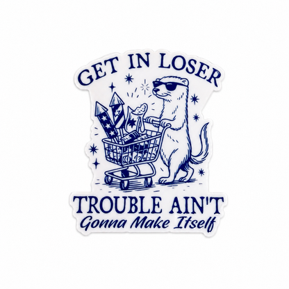 GET IN LOSER TROUBLE AIN'T GONNA MAKE Itself plastic add-on featuring a sunglasses-wearing animal pushing a shopping cart filled with fireworks, compatible with interchangeable badge reel bases.