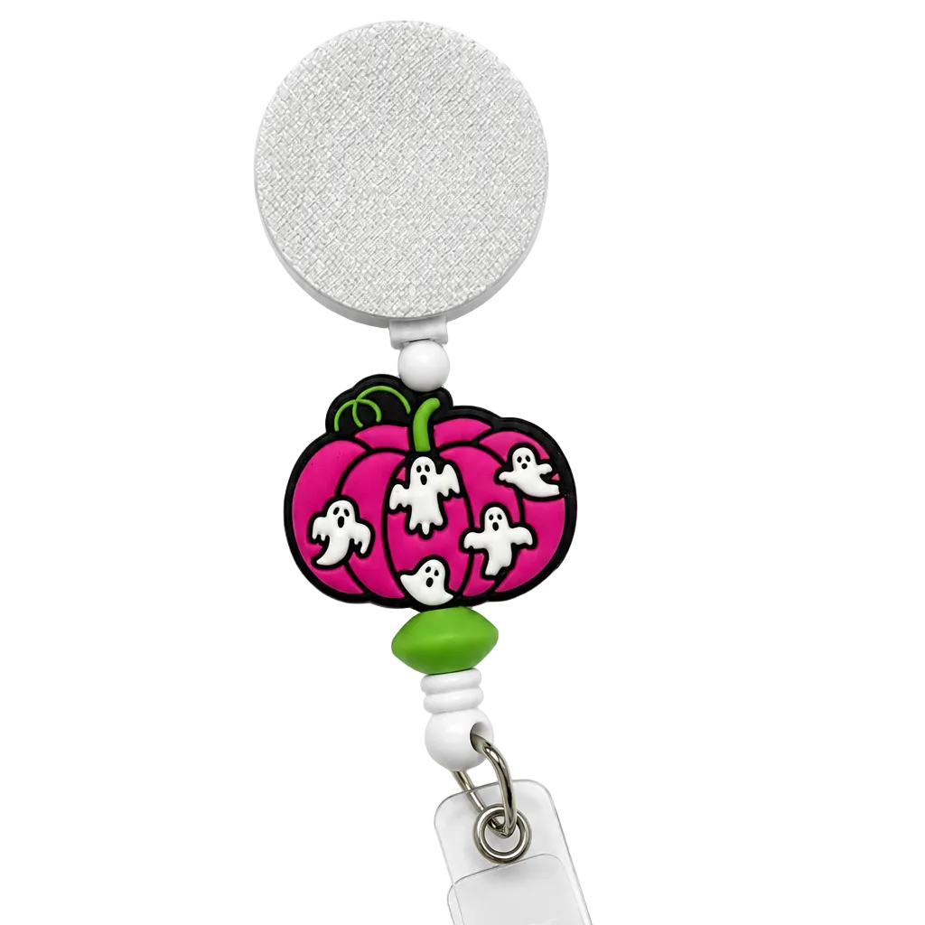 Ghosts in the Pumpkin Patch badge reel featuring a bright pink pumpkin with four cute white ghosts, green bead accents, a retractable badge reel, and secure badge holder attachment.