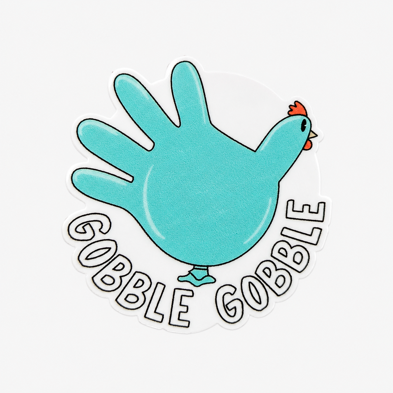 GOBBLE GOBBLE plastic add-on with blue glove turkey design, compatible with interchangeable badge reel bases.