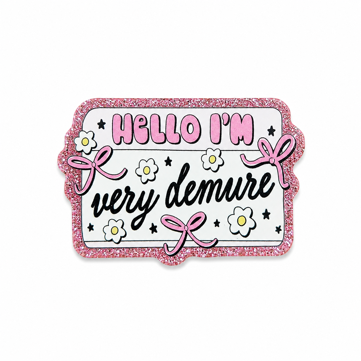 Hello I'm very demure plastic add-on featuring pink bows, white flowers, and a glitter-inspired border, compatible with interchangeable badge reel bases and perfect for fans of cute trendy accessories.