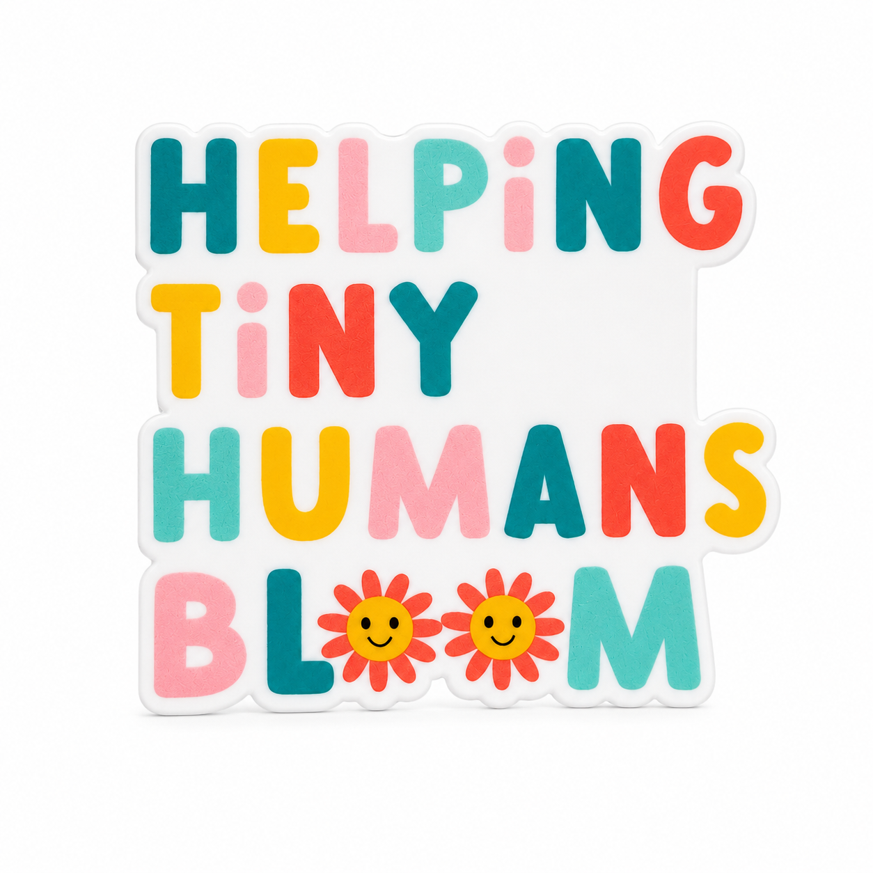 HELPING TINY HUMANS BLOOM plastic add-on featuring colorful lettering and smiling flowers, compatible with interchangeable badge reel bases, pediatric nurse accessory