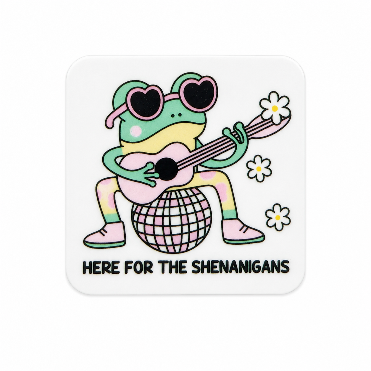 Plastic add-on featuring a frog wearing heart-shaped sunglasses, playing a guitar on a disco ball with the phrase "HERE FOR THE SHENANIGANS," compatible with interchangeable badge reel bases.