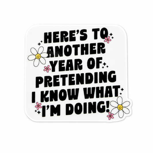 Here's To Another Year Of Pretending I Know What I'm Doing plastic add-on featuring bold text and daisy flowers, compatible with interchangeable badge reel bases, funny coworker gift and work accessory.