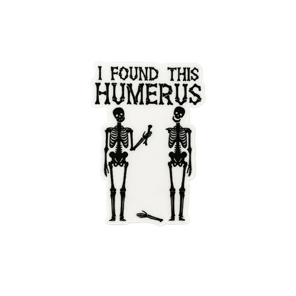 Funny skeleton “I Found This Humerus” plastic add-on with spooky anatomy design for compatible interchangeable badge reel bases